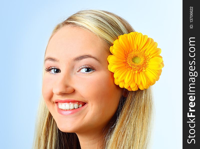 Sensual portrait of beautiful young blond woman with flower. Isolated on white background. Sensual portrait of beautiful young blond woman with flower. Isolated on white background