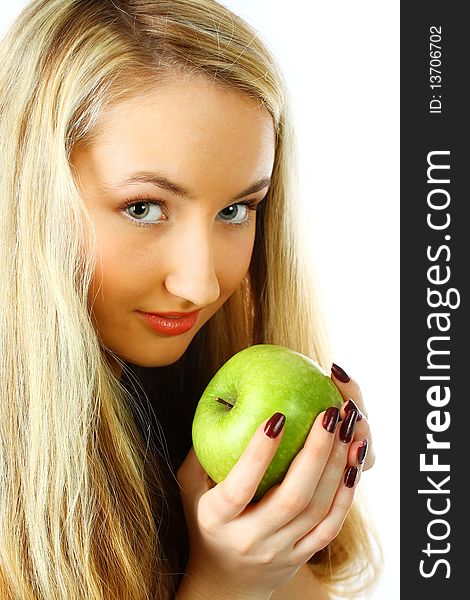 Pretty young woman with green apple.