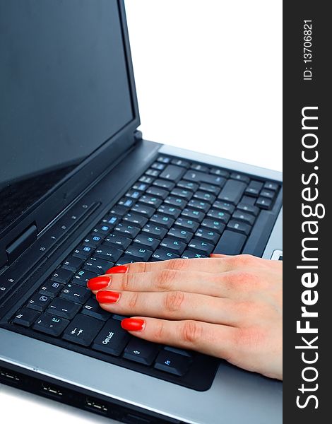 Fingers typing on a modern laptop keyboard