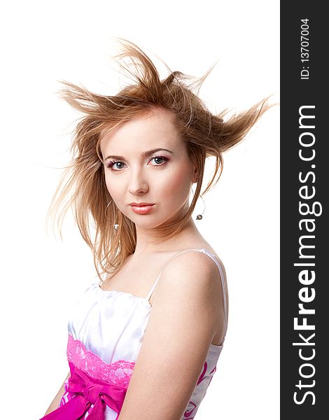 Beautiful girl with flying hair over white