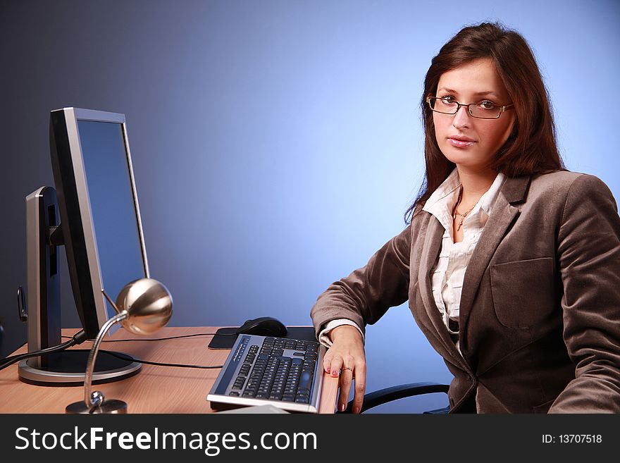 Young businesswoman working in office. Young businesswoman working in office