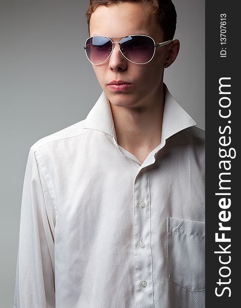 Portrait of young handsome man in sunglasses