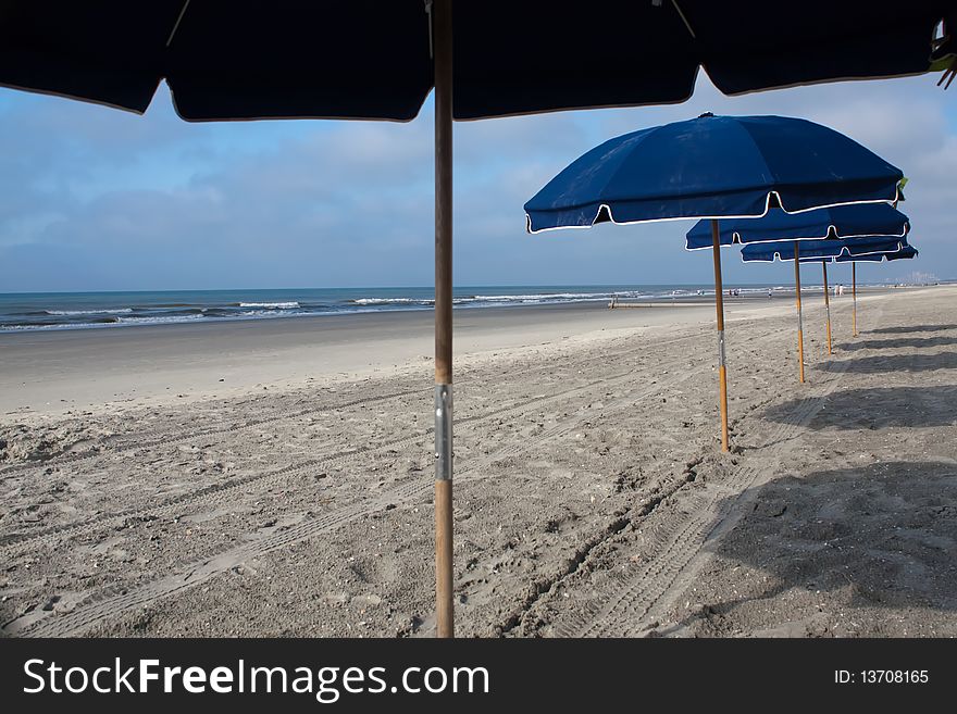 Beach umbrellas in the sand - landscape. Beach umbrellas in the sand - landscape