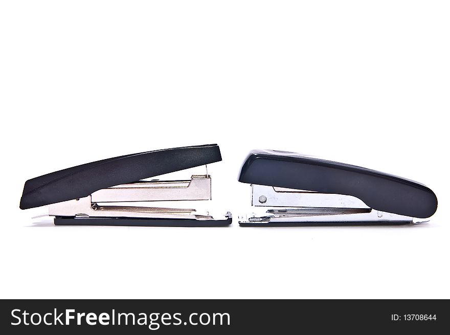Two black staplers isolated on white background. Two black staplers isolated on white background