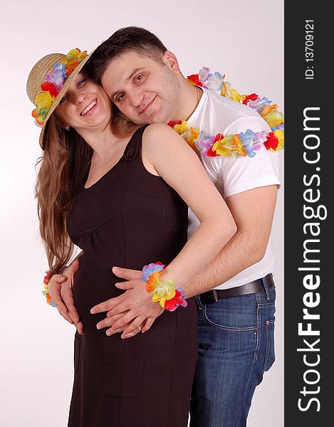 The pregnant woman and the man on a white background