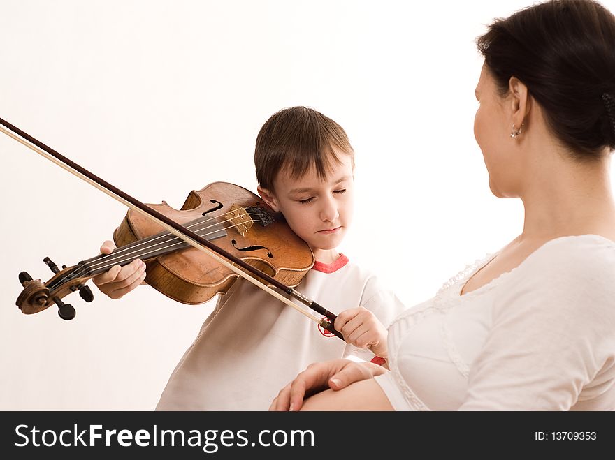 Pregnant woman and the son of a violin on white