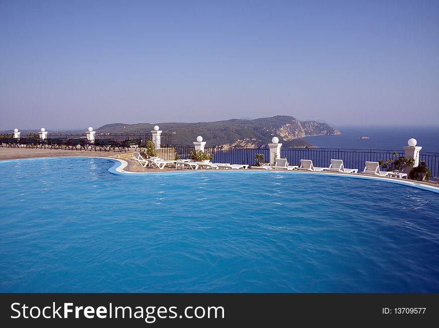 Swimming pool with ocean and mountain view