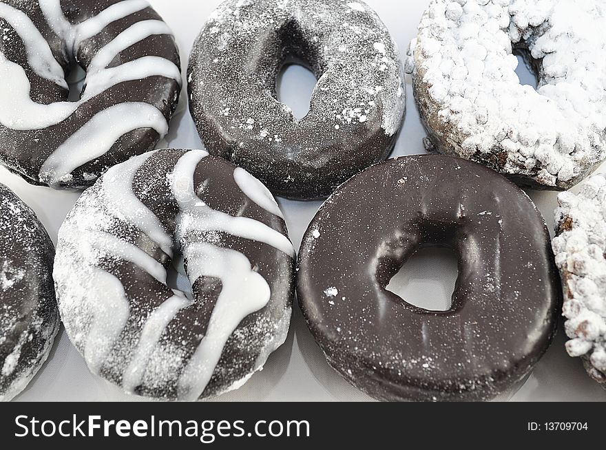 Arrangement of fresh chocolate donuts