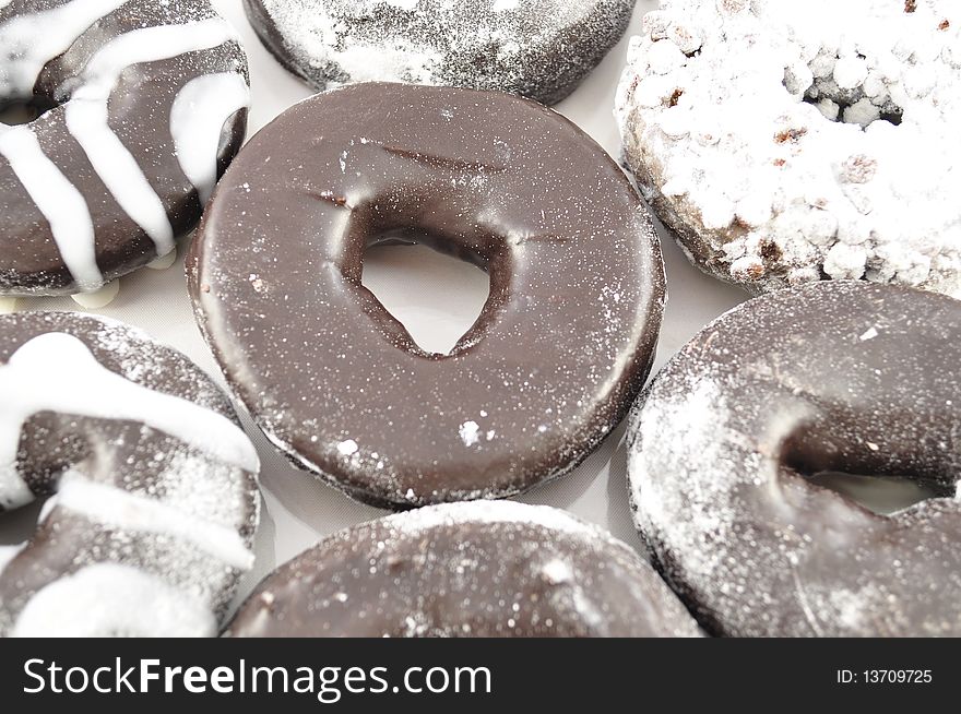 Arrangement of fresh chocolate donuts