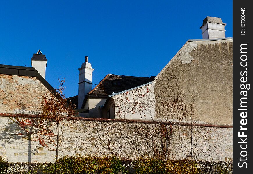 Chimneys And Flat Brick Fire Walls Along The Public Belvedere Park In Vienna