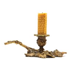 Old Bronze Candlestick With A Candle Stock Image