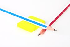 Two Colorful Pencils And Yellow Rubber On White Stock Photos
