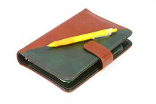 Closed Leather Office Organizer And A Yellow Pen Royalty Free Stock Photography