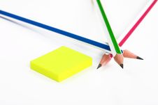 Colorful Pencils Crossed And Yellow Rubber Stock Photos