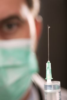 Doctor With Medical Syringe In Hands Stock Images