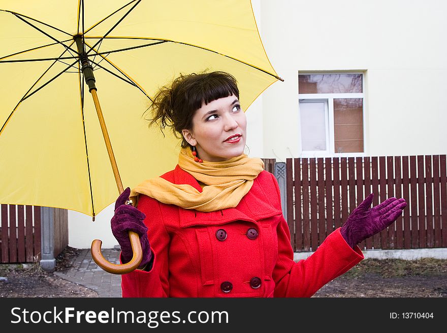 Beautiful girl on red coat with yellow. Beautiful girl on red coat with yellow