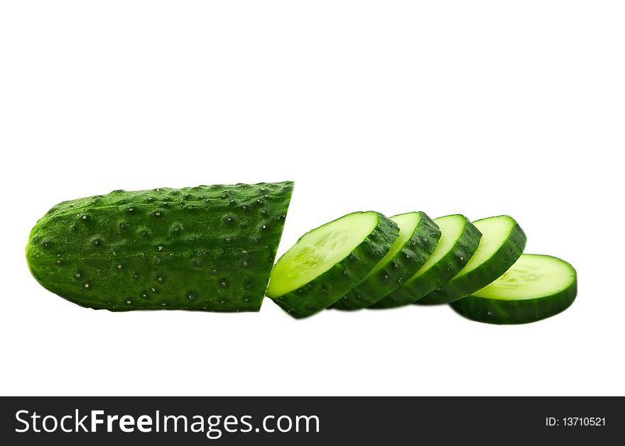 Fresh cucumber with slices isolated on white