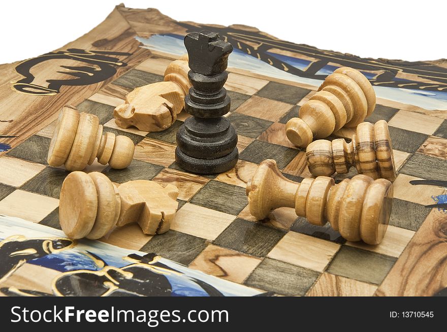 Chess and chessboard of wood on white background