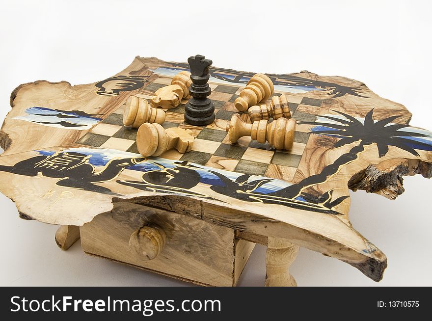 Chess and chessboard of wood on white background