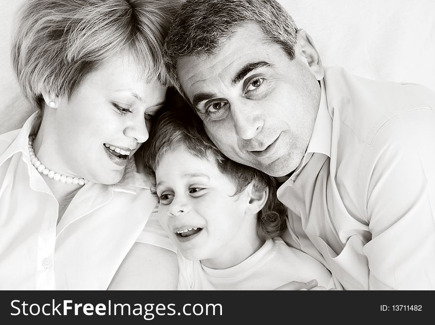 Happy family home: father, mother and - black and white photo. Happy family home: father, mother and - black and white photo