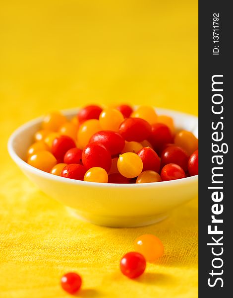 Fresh red and yellow tomatoes cherry in a bowl. Fresh red and yellow tomatoes cherry in a bowl