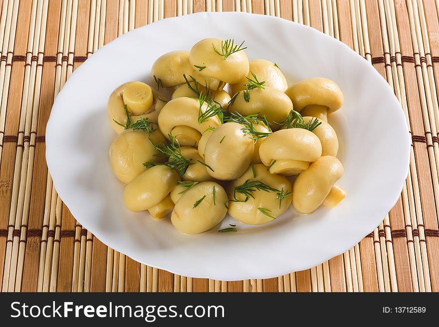 Dish with marinated mushrooms, dill. Dish with marinated mushrooms, dill