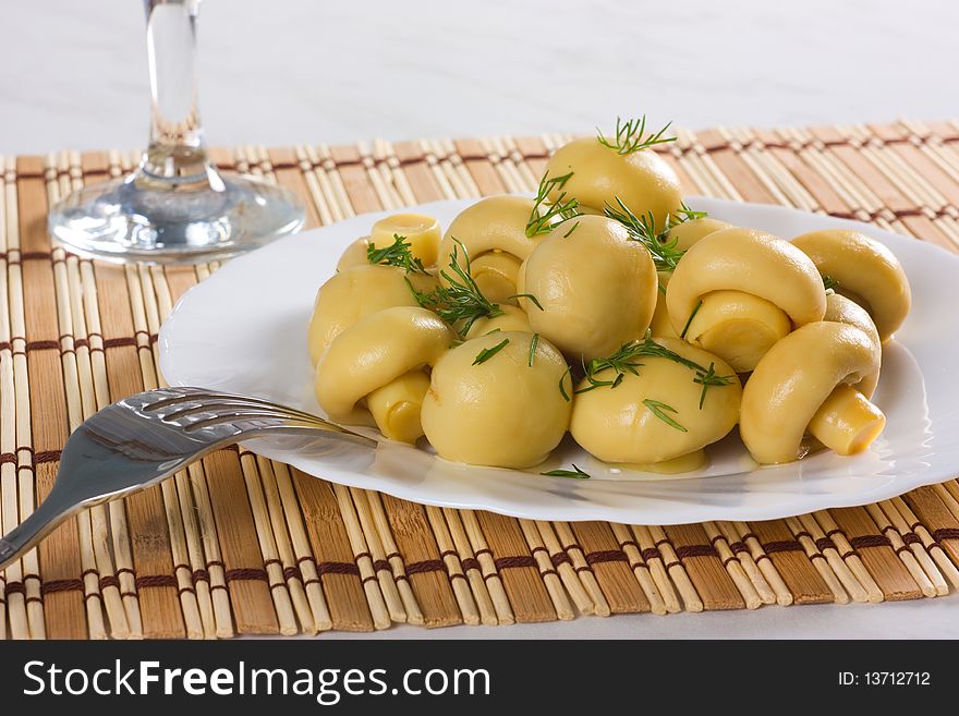 Dish with marinated mushrooms, dill. Dish with marinated mushrooms, dill