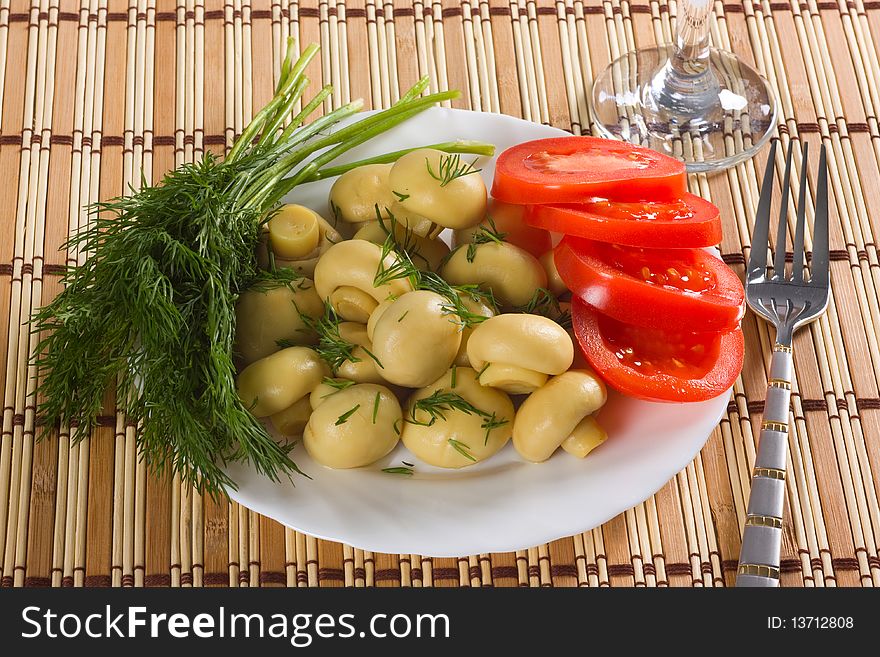 Dish with marinated mushrooms, dill. Dish with marinated mushrooms, dill