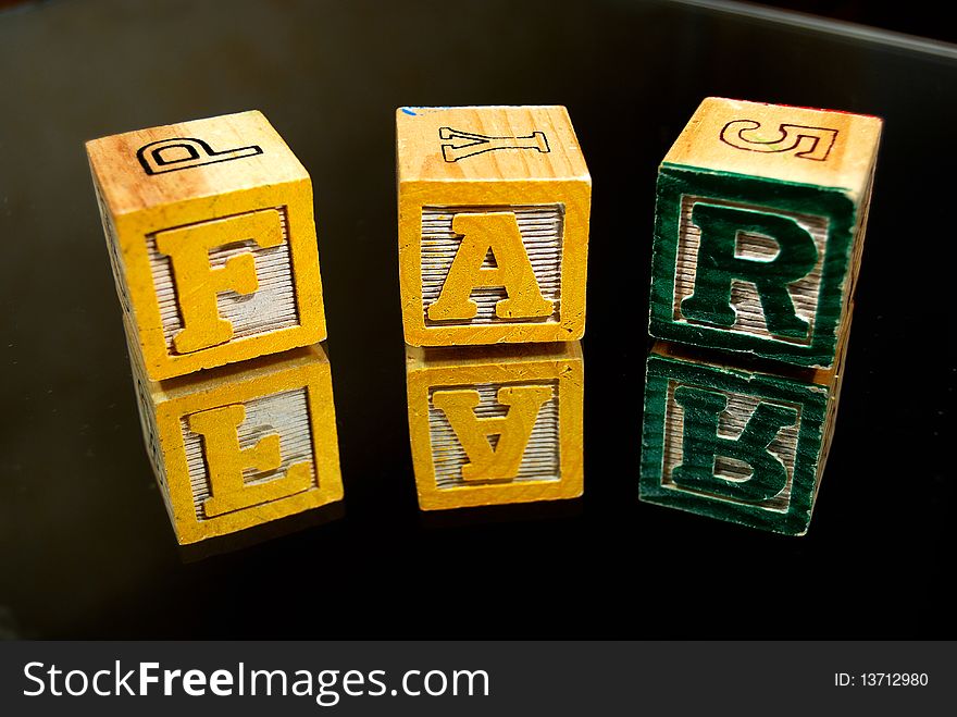 Wooden Kid S Blocks On A Black Background