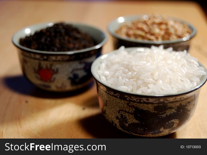 Rice, buckwheat and black leaf tea in Chinese cups. Rice, buckwheat and black leaf tea in Chinese cups