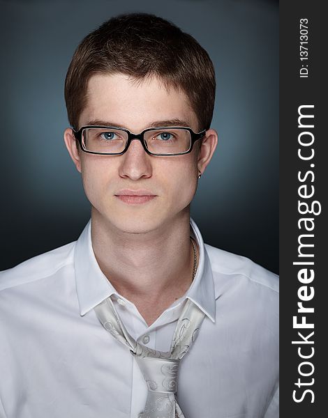 Young handsome caucasian man over grey background. Young handsome caucasian man over grey background