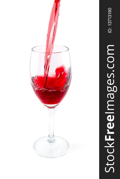 Red wine being poured into glass. isolated path included