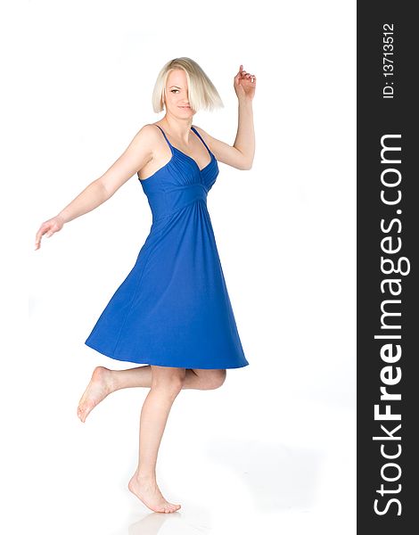 Blonde woman in blue dress spinning. Blonde woman in blue dress spinning