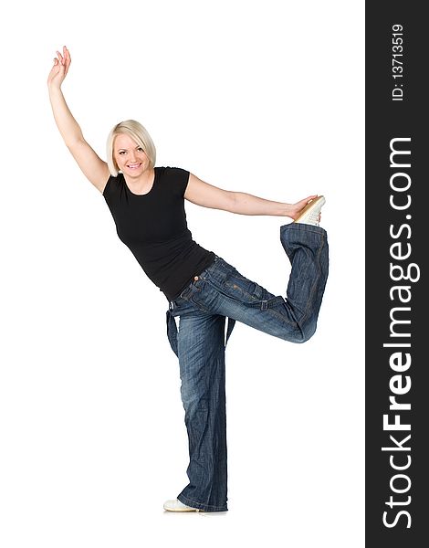 Blonde woman in jeans and a dark shirt, smiling performs acrobatic etude. Isolated on the white. Blonde woman in jeans and a dark shirt, smiling performs acrobatic etude. Isolated on the white