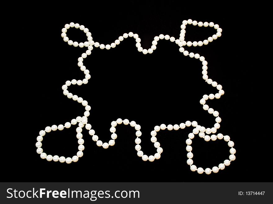 Pearls on the black background