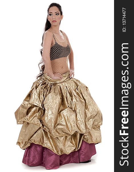 Beautiful blond belly dancer in golden costume dancing over white background