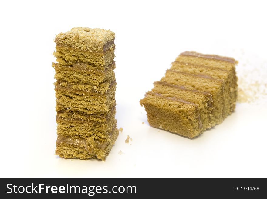 Two pieces of cake on white background