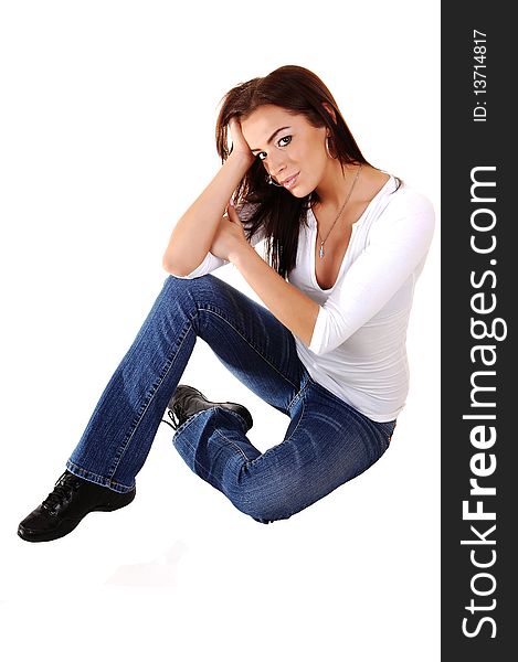 A young pretty sad looking girl sitting on the floor, holding her head, in 
jeans and running shoos, for white background. A young pretty sad looking girl sitting on the floor, holding her head, in 
jeans and running shoos, for white background.