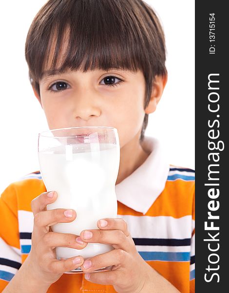 Happy kid drinking glass of milk on isolated background