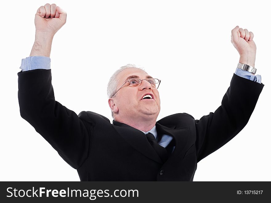 Champion senior business man standing with fists clenched in victory in white background