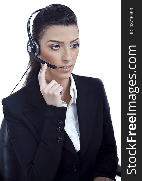 Beautiful call center telephone woman wearing headset over white background