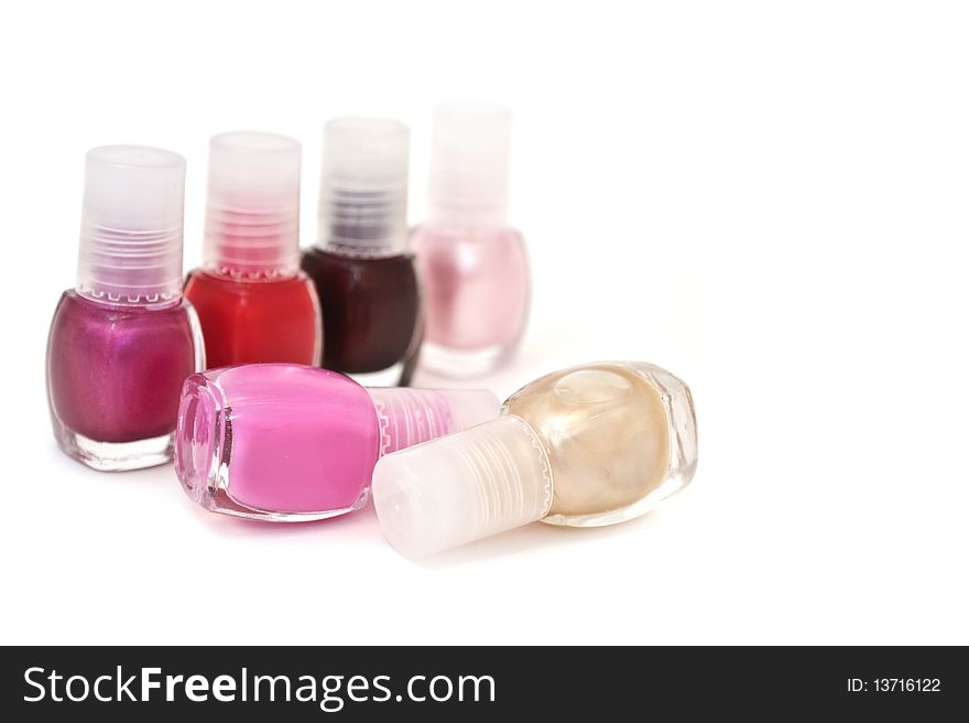 Bottles with nail polish isolated on a white background