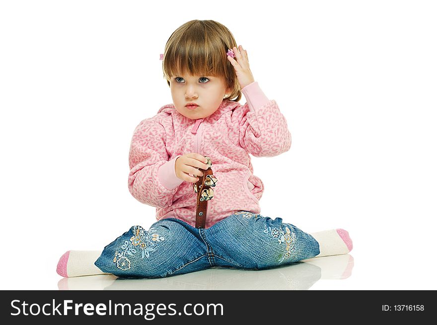 Little girl in jeans and pink sweater on white background. Little girl in jeans and pink sweater on white background