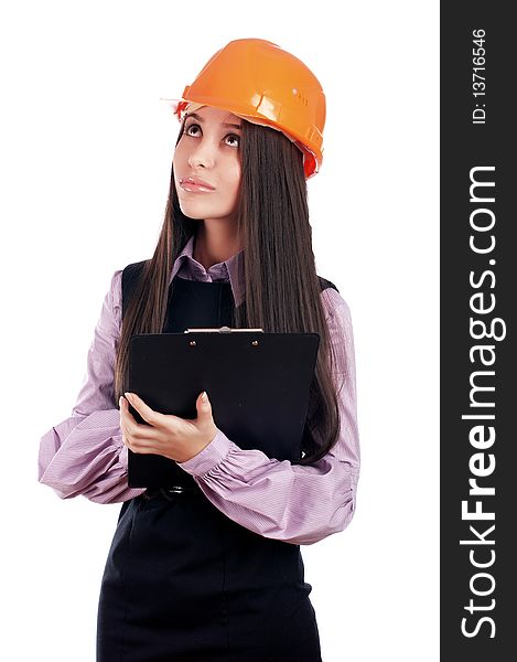 Charming young businesswoman builder orange helmet is isolated on a white background. Charming young businesswoman builder orange helmet is isolated on a white background