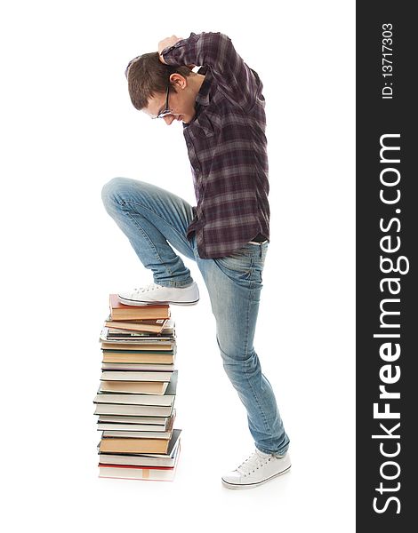 The young student with the books isolated on a white background