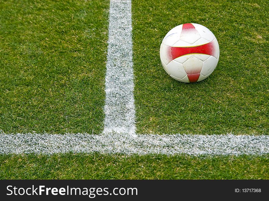 Soccer ball against grass background