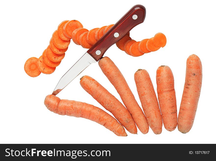 Few carrots, one sliced carrot and knife isolated on white background with clipping path. Few carrots, one sliced carrot and knife isolated on white background with clipping path