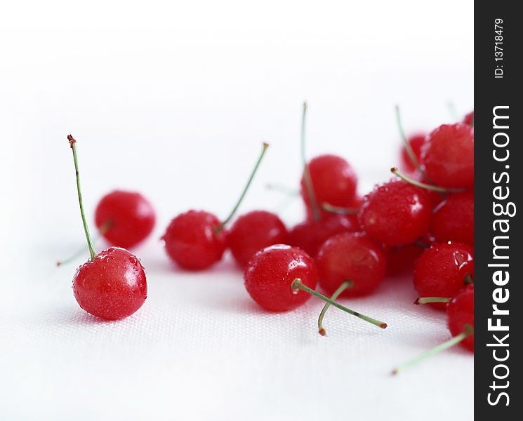 Fresh ripe cherries on a white background