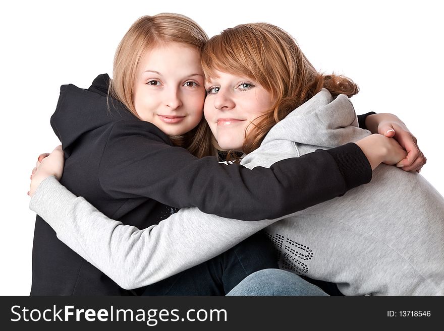 Two smiling girl. Isolated on white