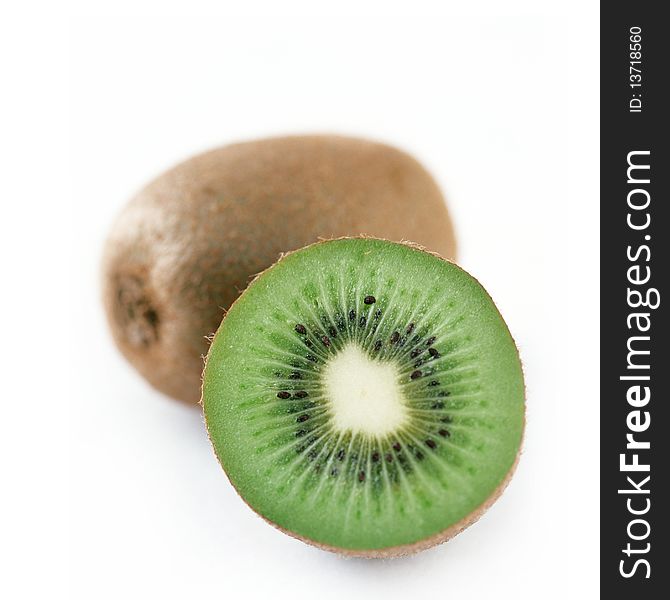 And half a kiwi fruit on white background. And half a kiwi fruit on white background